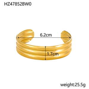 Detail shot of golden C-shaped stainless steel bangle with 1.7cm width and 6.2cm diameter