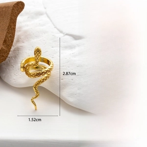 Detailed size view of a gold snake ear cuff with zircon inlay and scale textures