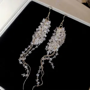 French crystal beaded tassel drop earrings with gold chains on black velvet box