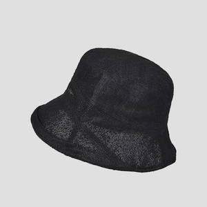 Detail of black breathable woven sun hat showing fine lace texture and metal plate