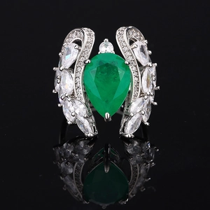 Elegant pear-shaped green emerald ring with silver band and cubic zirconia accents
