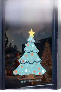 Detailed close-up of blue Christmas tree window sticker with Merry Christmas greeting