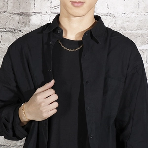 Model wearing a gold-plated stainless steel chain necklace and matching bracelet set
