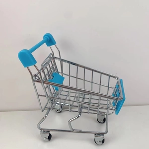 Detail of mini metal shopping cart toy with blue plastic handle and rotating wheels
