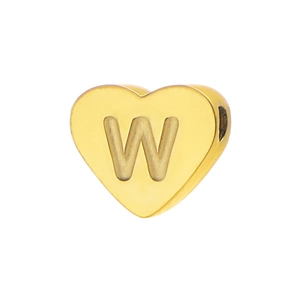 Macro shot of gold heart-shaped titanium charm with letter W engraving for DIY jewelry