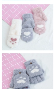 Close-up of plush half-finger gloves with cute cat paw design and buttoned flip top cover