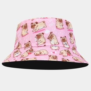 Detailed close-up of pink bucket hat with pug patterns and I love PUGS text