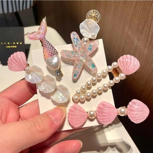 6-piece starfish and mermaid hair clip set with pink pearls for young girls