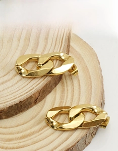 Detailed close-up of 18K gold plated thick chain link earrings on a natural wood surface