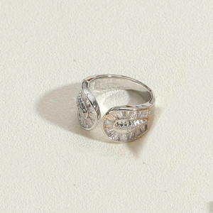 Detailed close-up of adjustable 14k gold plated ring with sparkling zircon in fan shape