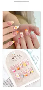 Detailed view of 3D plumeria flower nails with macaron gradient and pearl accents