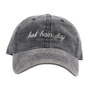 Vintage washed charcoal grey baseball cap with white 'bad hair day' embroidery