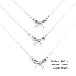 Three-piece stainless steel bow necklace bracelet and anklet set with adjustable chain