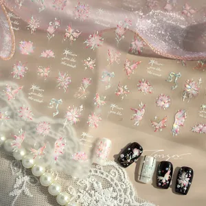 Macro shot of M-941 holographic butterfly and floral nail art stickers on lace background