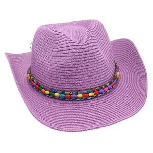 Detail of purple straw cowboy hat featuring colorful beaded trim and ethnic style band