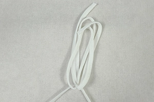 Macro detail of high-elastic white drawcord fabric texture and textile fibers