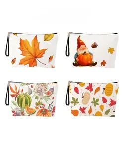 Detailed grid showing four autumn-themed canvas cosmetic bags with pumpkins and maple leaves