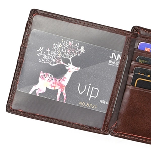 Detail of dark brown leather wallet showing red stitching, card slots and ID window