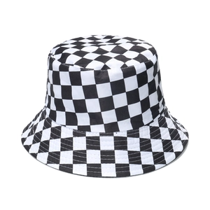 Classic black and white checkerboard bucket hat in cotton canvas on a white background