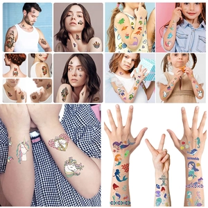 Detailed view of colorful temporary tattoo stickers on skin with various festive patterns