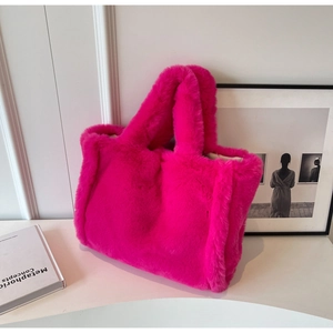 Detail of fuchsia faux fur tote bag showing soft plush texture and integrated handle