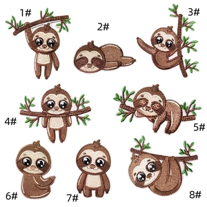 Detailed embroidery texture of cute sloth patches showing premium thread quality