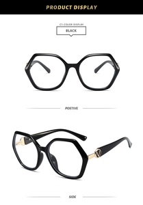 Detail of polygonal TR90 frames with golden V-shaped metal accent on black temples