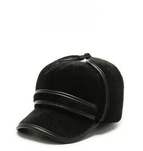 Detailed view of black faux fur winter cap with premium leather piping for men