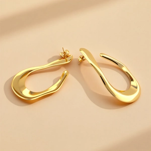 Modern gold irregular flow line earrings with high polished metallic finish and abstract art
