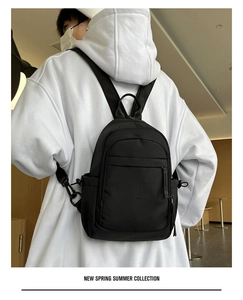 Casual nylon mini backpack for men and women, versatile black daypack for daily use.