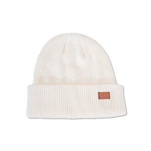 Close-up of white ribbed knit beanie featuring a brown leather patch and warm texture