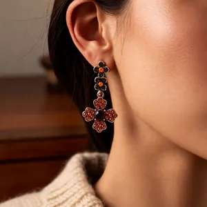 French vintage zircon water drop earrings set in gold finish worn by a model