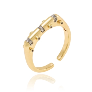Elegant gold flower open ring with sparkling geometric zircon stones on white background