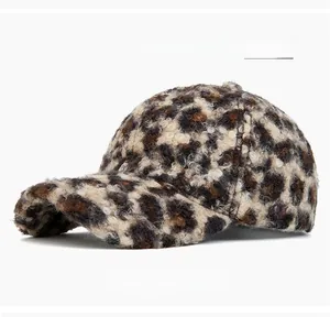 Detail of plush leopard print baseball cap showing fuzzy fleece texture and curved brim