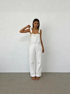 Women's loose white denim overalls with adjustable straps and wide leg cut