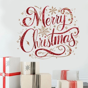 Detail of red Merry Christmas wall decal with snowflakes and festive ornaments on white wall