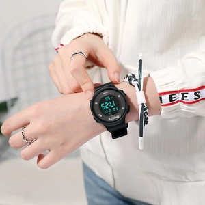 Waterproof luminous digital sports watch with black strap on male model wrist