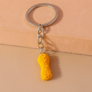 Creative yellow peanut-shaped keychain pendant with detailed rose textures and silver ring