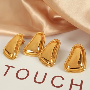 18K gold plated geometric paw earrings with polished mirror finish on champagne satin
