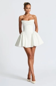 Close-up of the elegant strapless mini dress with a structured bodice and a puffy white skirt