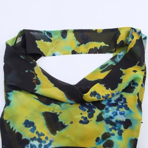 Women's long dress featuring abstract watercolor floral print on lightweight chiffon fabric