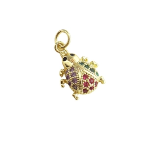 Golden ladybug pendant with colorful cubic zirconia stones on white background