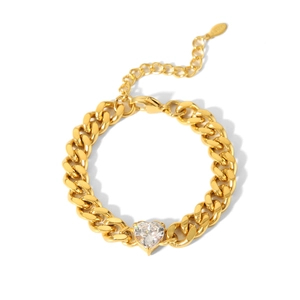 Detail of chunky gold chain bracelet featuring a large heart-shaped zircon and S925 tag