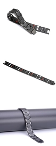 Detailed views of black magnetic therapy bracelet with red and white magnetic stone inlays