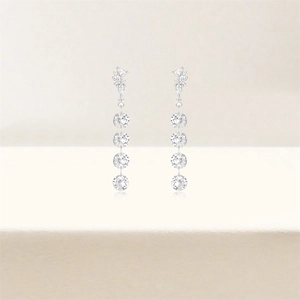 Detail of silver S925 long tassel earrings with luxury sparkling zircon flower cluster