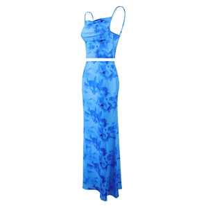 Side view of stylish blue tie-dye two-piece set featuring a crop top and long maxi skirt