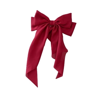 Large red bow hair clip with long ribbons, elegant bridal headpiece for weddings