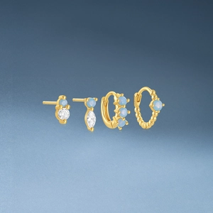 Detail of s925 silver gold floral earrings set with opal and sparkling zircon accents