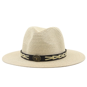 Beige Panama straw hat with black leather band and vintage metal bull head badge
