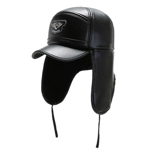 Winter faux leather baseball cap with ear flaps and fashion badge in classic black